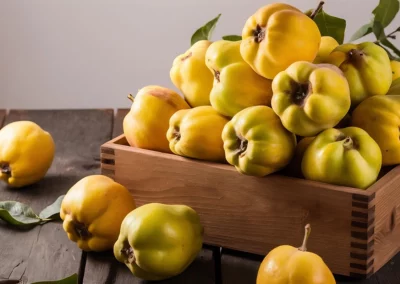 A pile of yellow quinces in a wooden crate